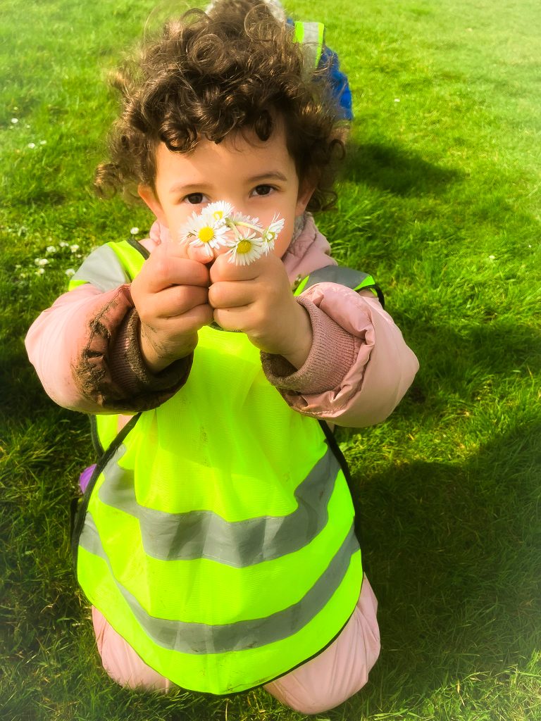 Child exploring outdoors at ME Montessori nursery, Aylesbury