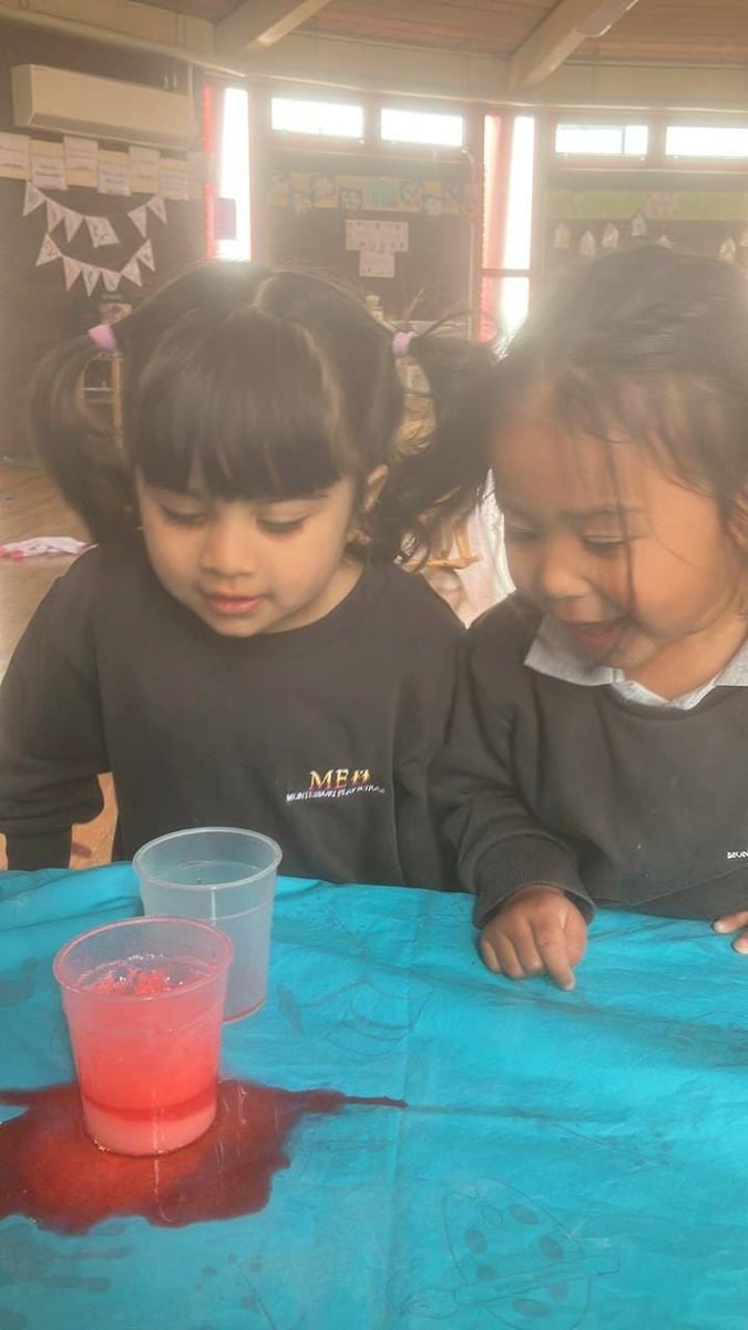 Toddlers exploring sensory liquid play at ME Montessori Nursery Aylesbury